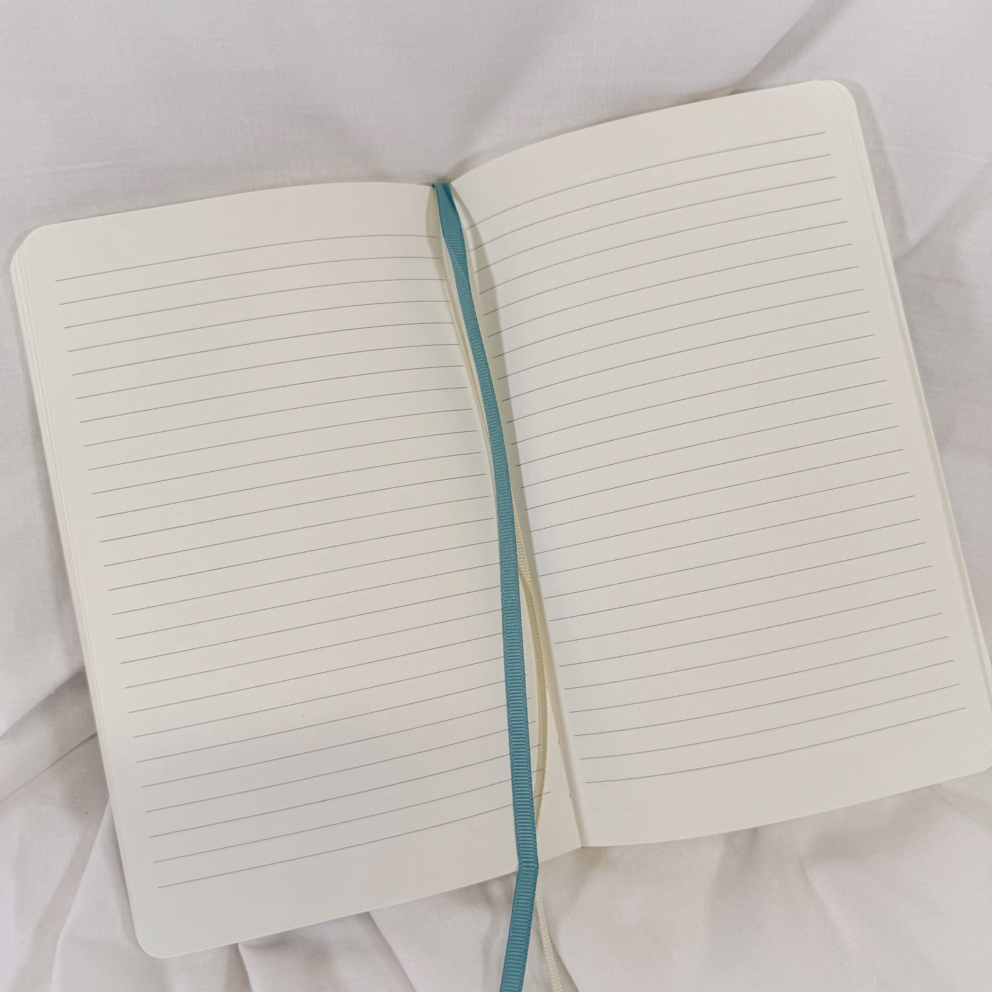 Vegan leather softcover A5 notebook in pastel blue with 192 lined sides