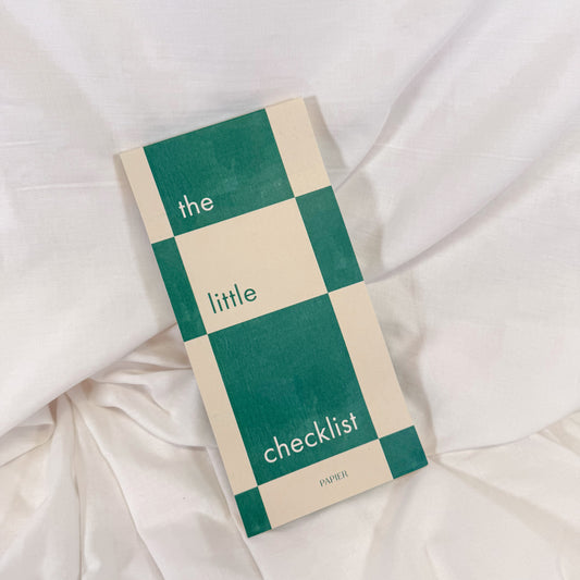 Top view of green and white checkered to-do list notepad on desk