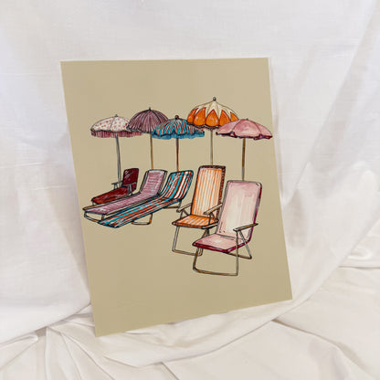 Colorful beach scene painted on a beige backgorund.