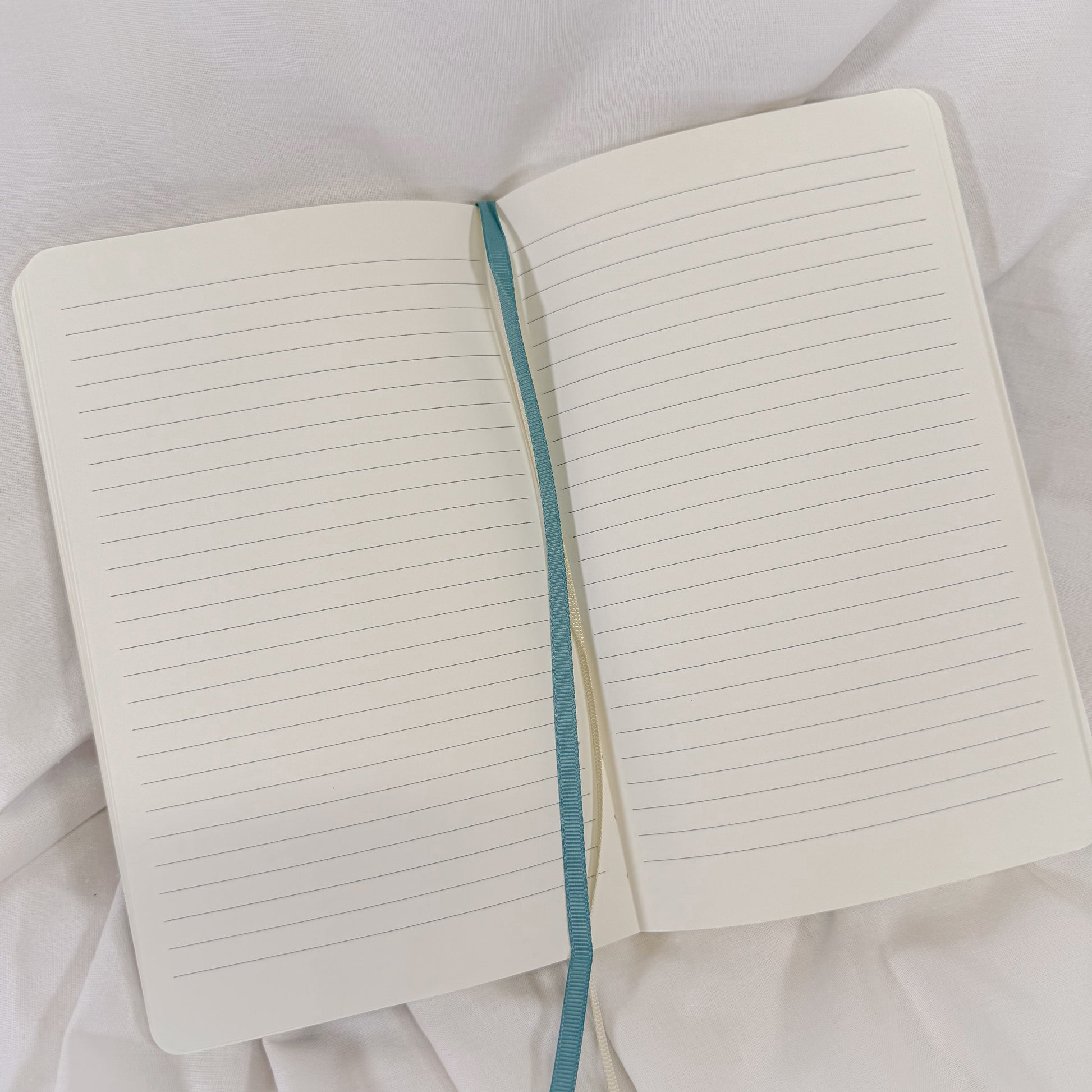 Vegan leather softcover A5 notebook in pastel blue with 192 lined sides