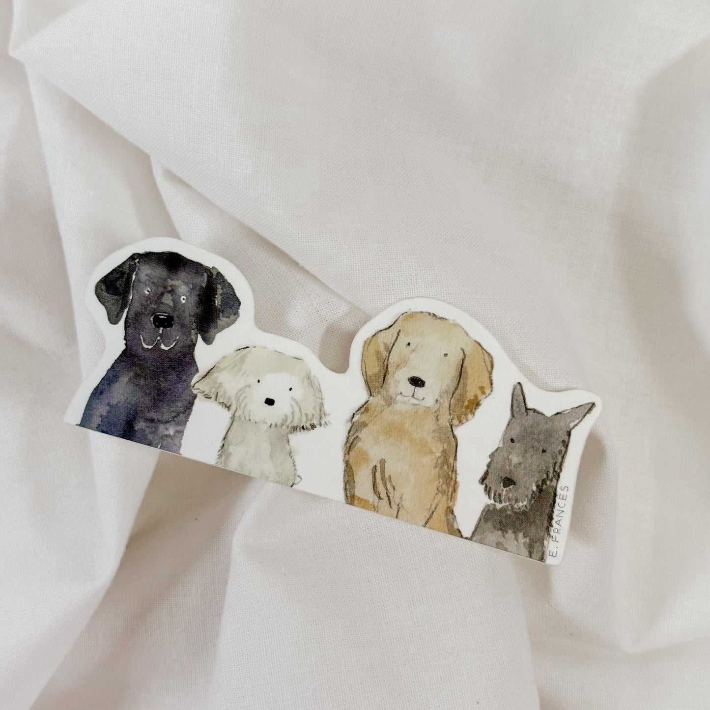Set of four watercolor animal stickers on a white fabric background